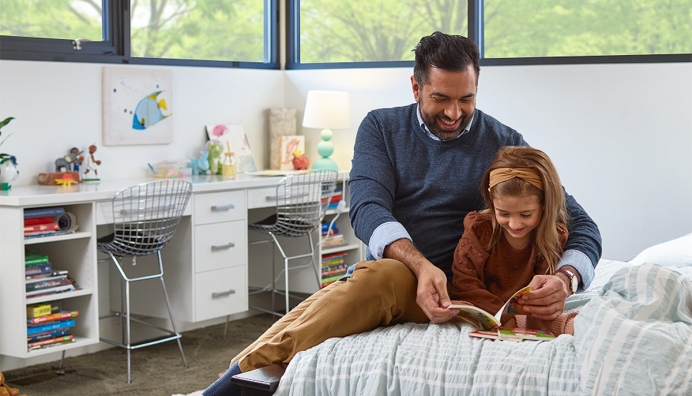 dad reading to daughter
