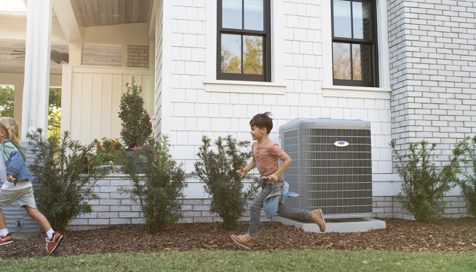 kids running in the yard past a/c unit